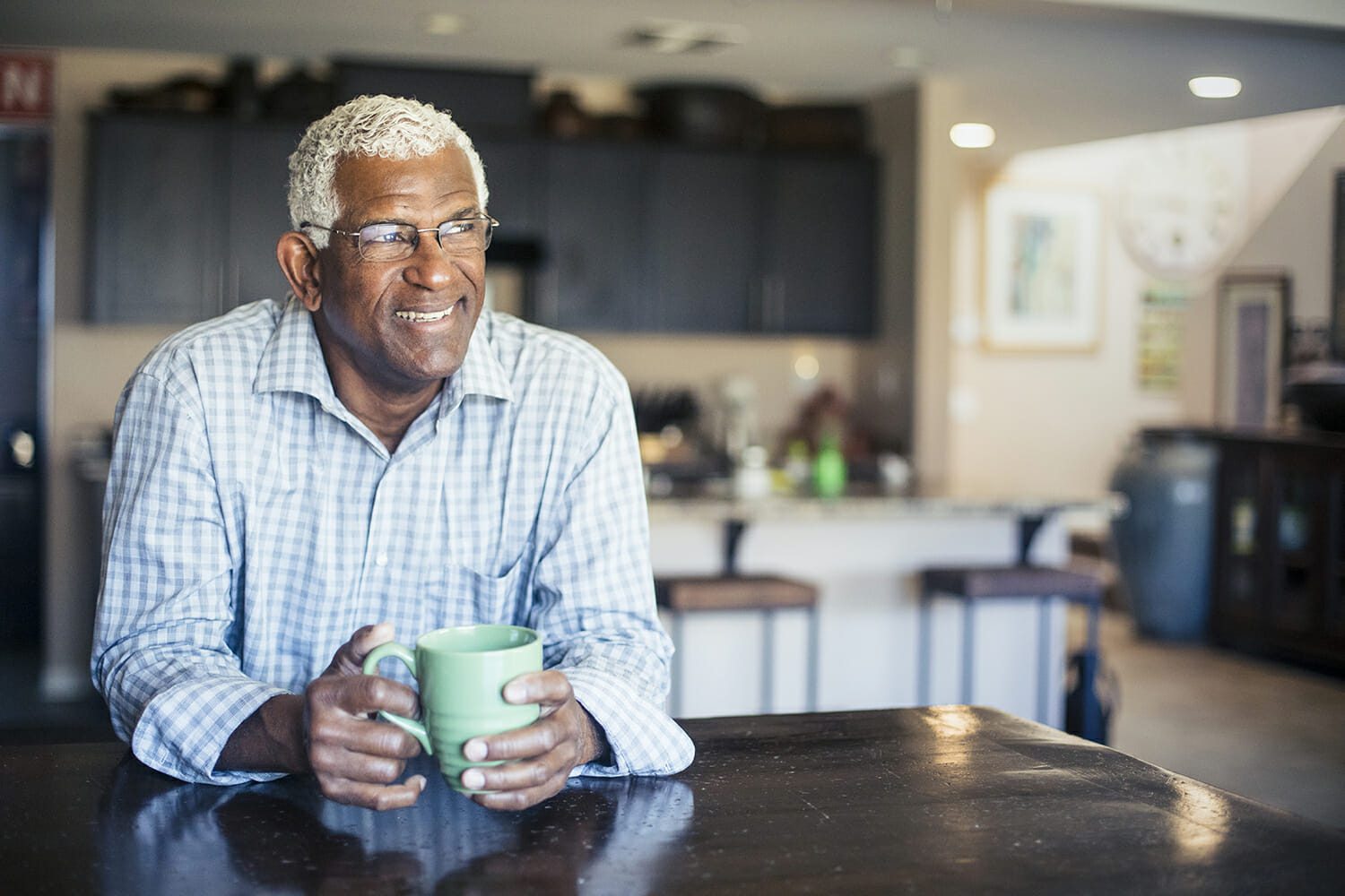 Senior Black Man Enjoying a Cup of Coffee at Home